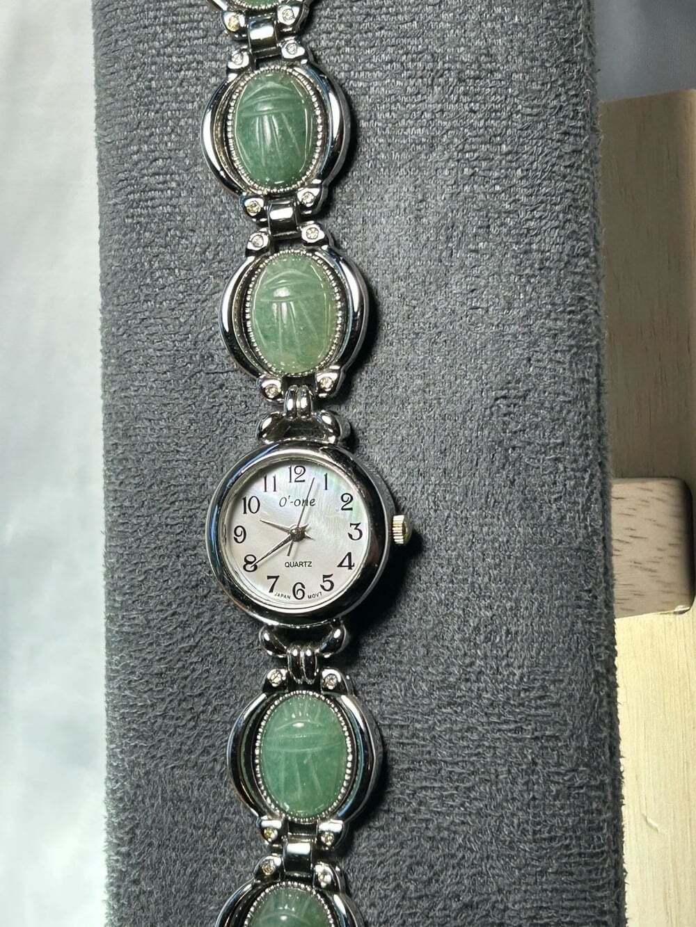 O’one Stainless Steel Green Jade colored Scarabs ladies watch pearl faced watch